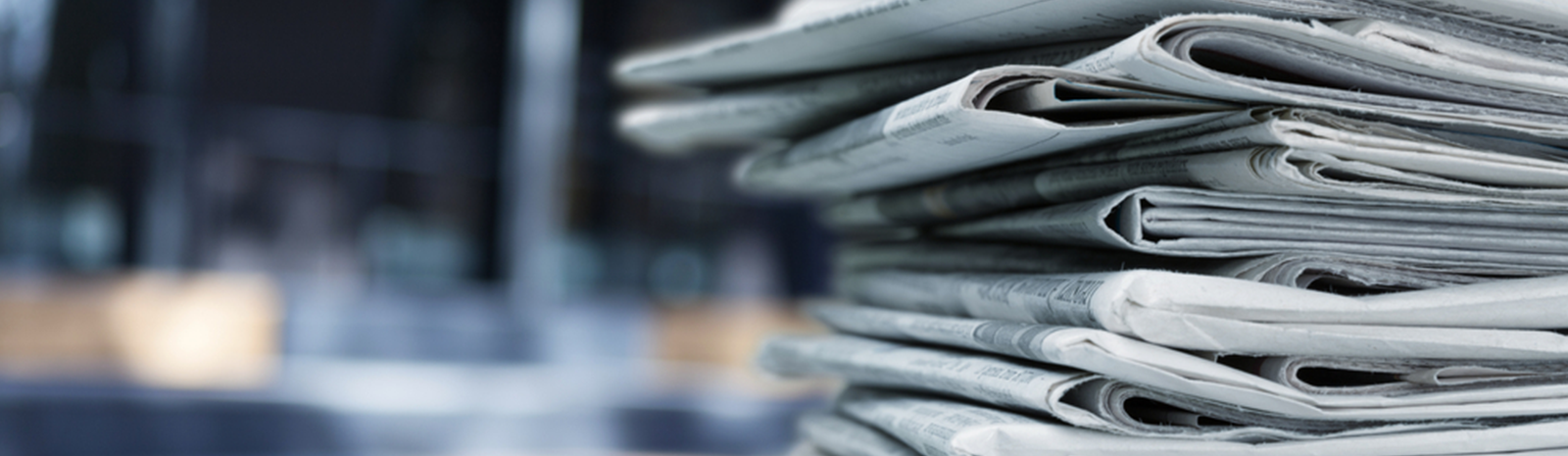 Stack of newspapers in an office