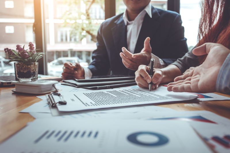 man and woman reviewing reports at work