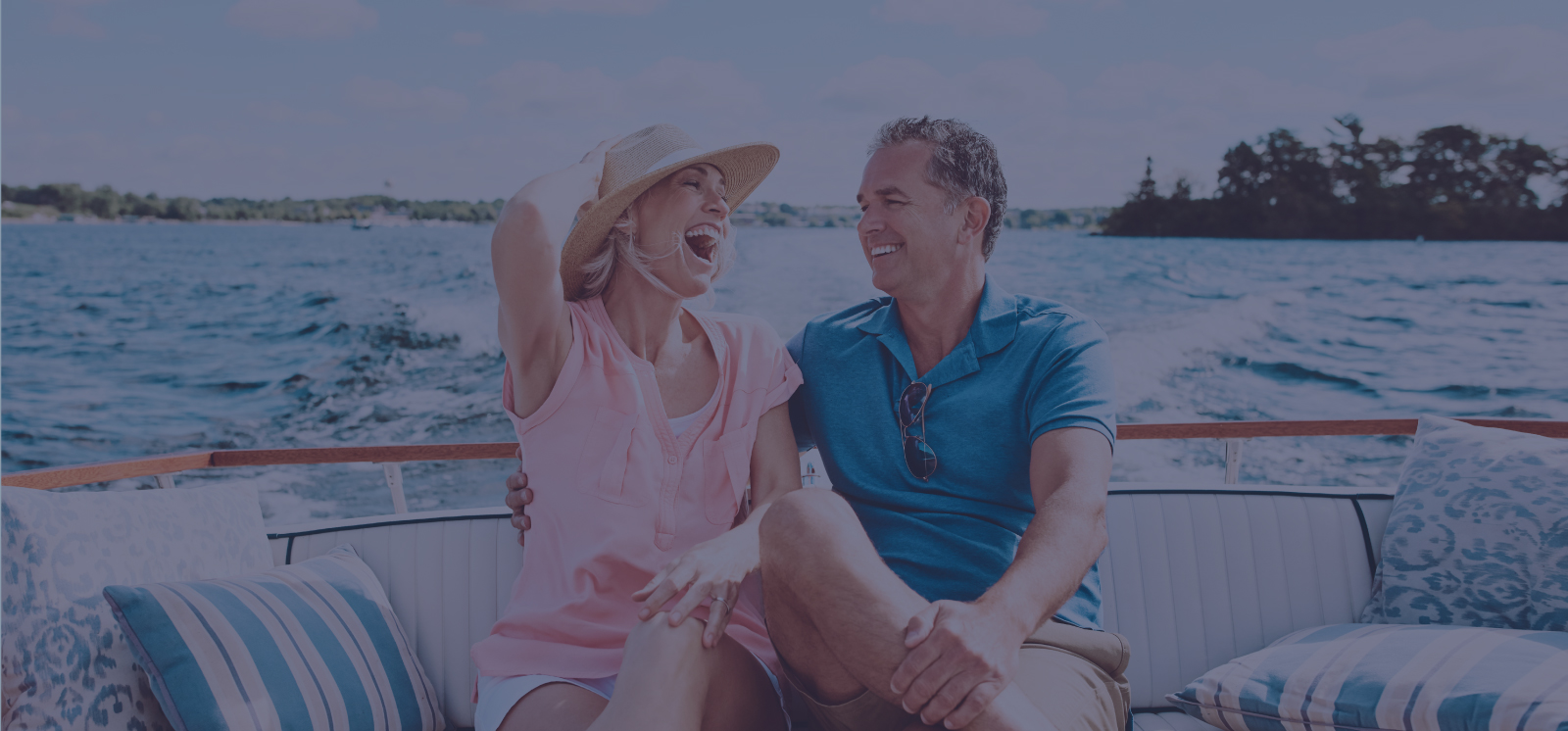 Man and Woman laughing on a boat