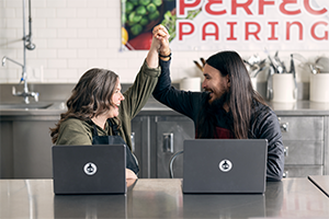 man and woman high fiving