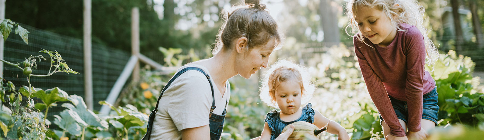 Mother and daughters in garden
