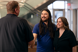 man and woman talking to banker